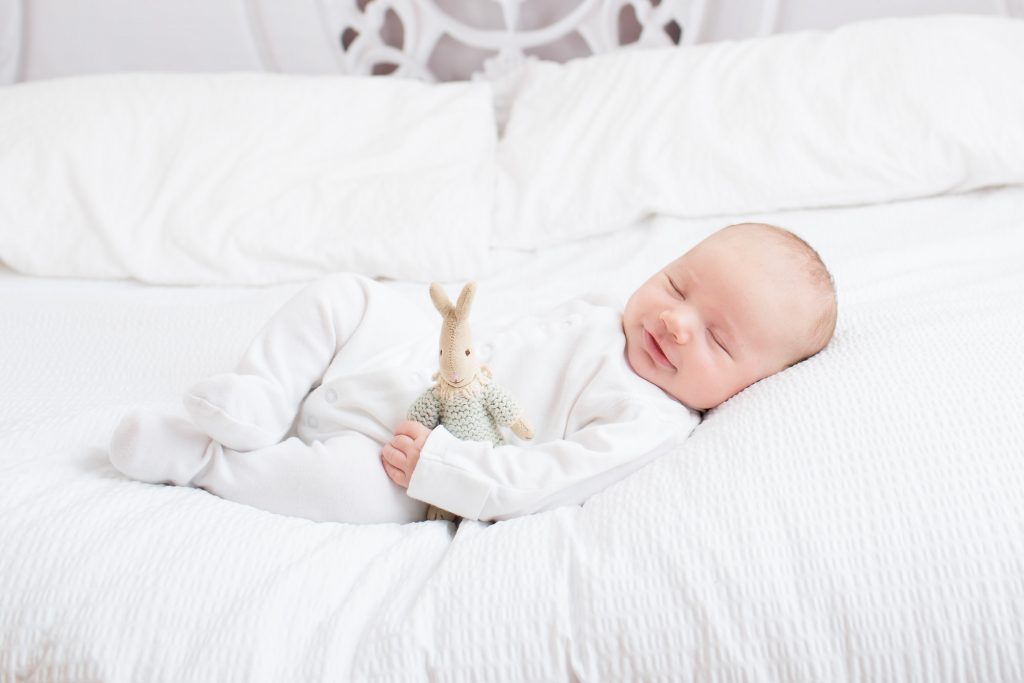 Baby on white bed